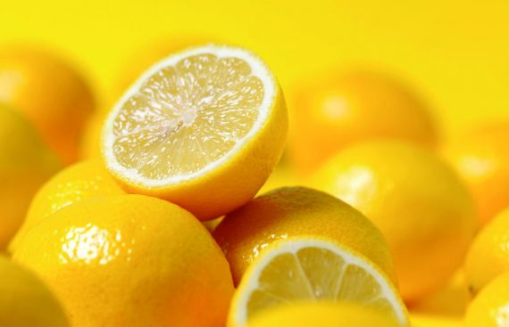 group of lemon on yellow background